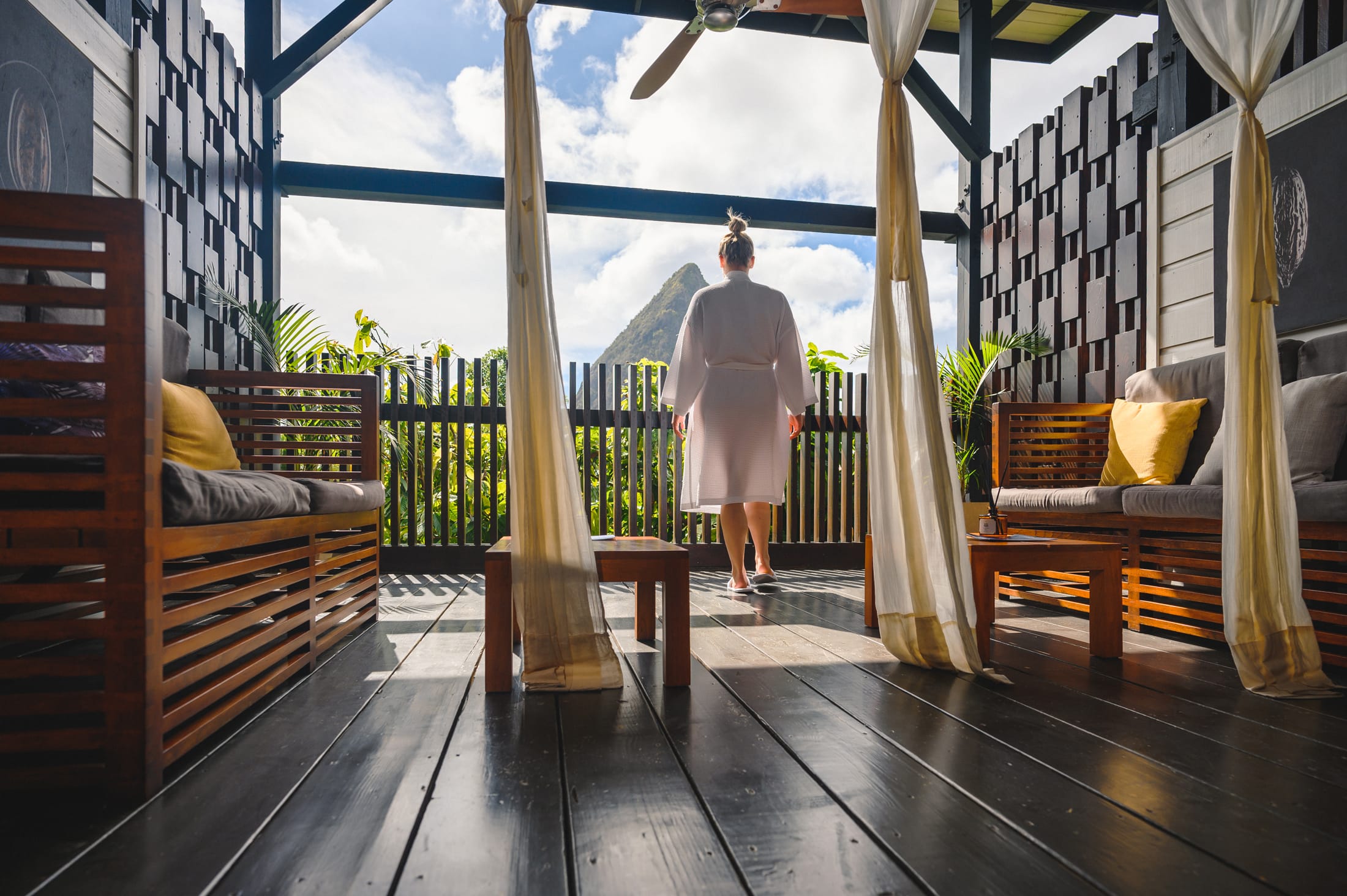 Guest in a robe looking towards Petit Piton from Beauté de Cacao at Rabot Hotel