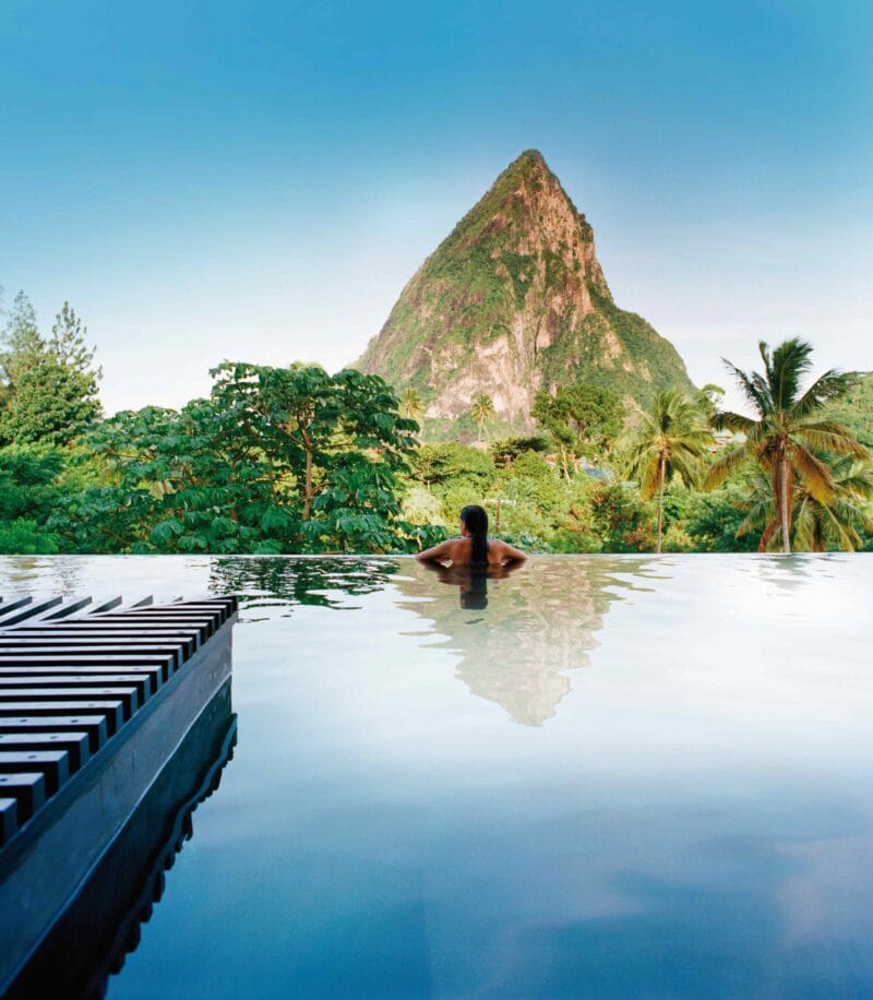 Guest relaxing in the infinity pool at Rabot Hotel with Petit Piton beyond